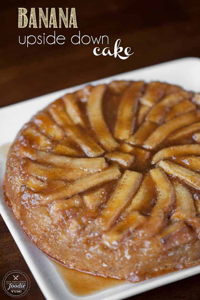 whole Upside Down Cake with bananas on white plate