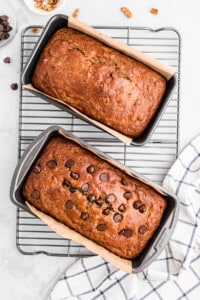 two loaves of banana zucchini bread, one with chocolate chips and one without.