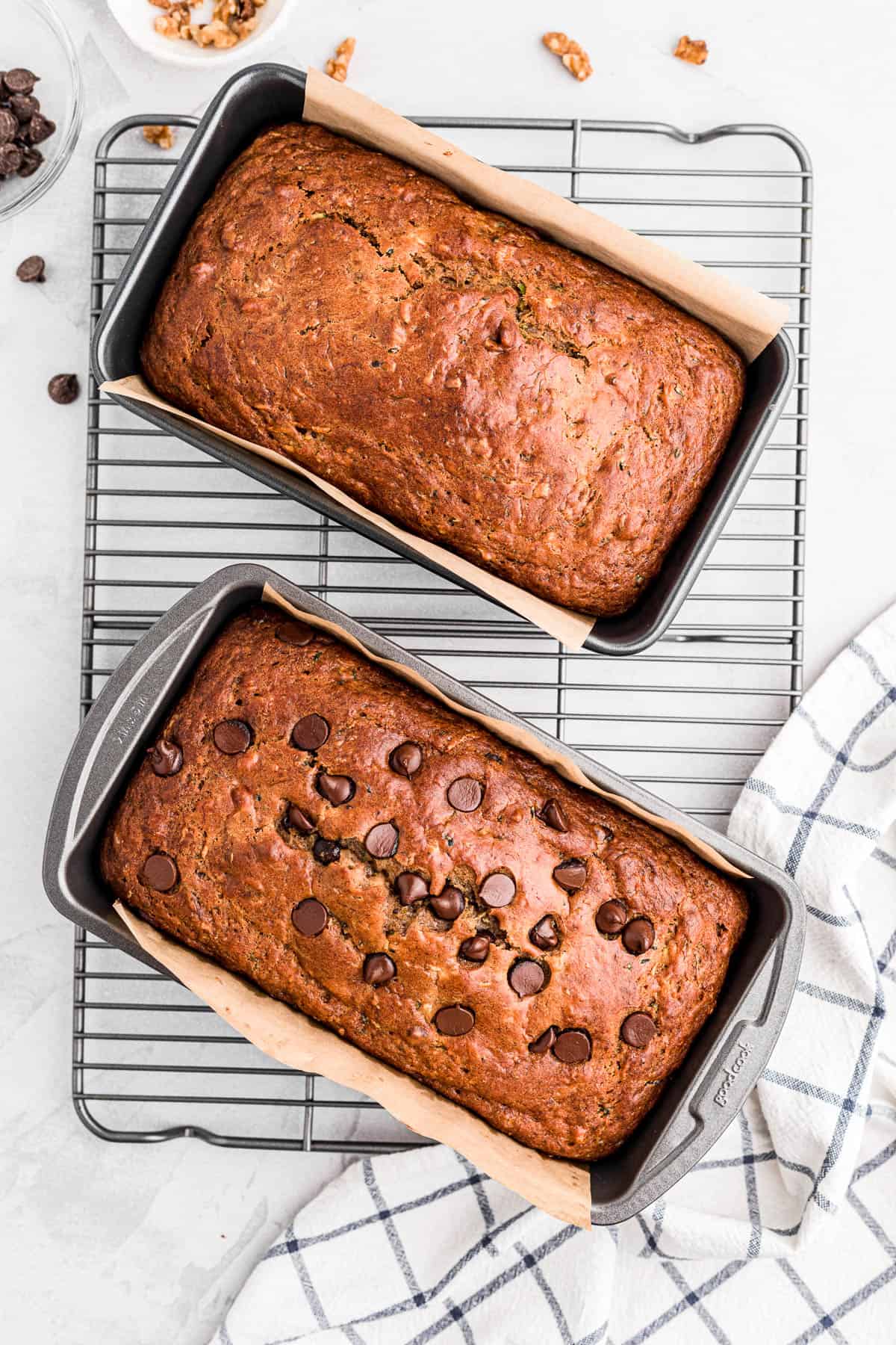 two loaves of banana zucchini bread, one with chocolate chips and one without.