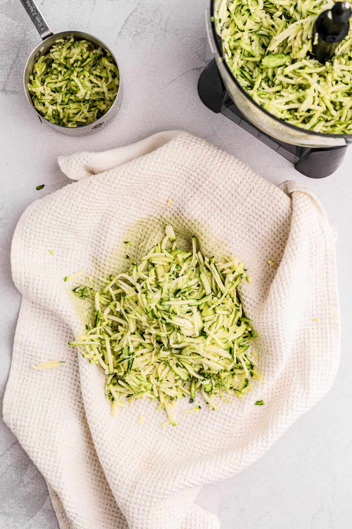 squeezing excess moisture out of grated zucchini.