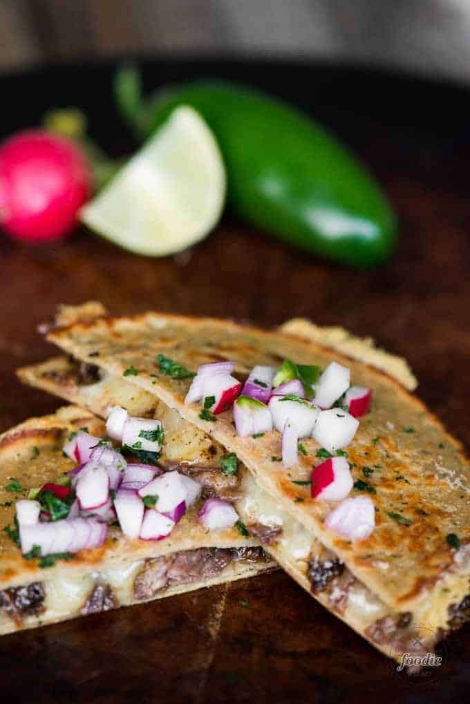 Barbacoa Quesadillas with pickled radish topping