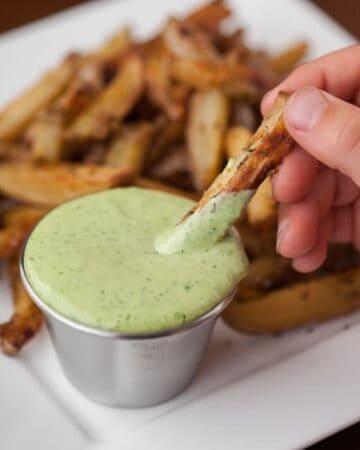 Basil Garlic Aioli sauce made from scratch only takes a few easy minutes and the result is a flavorful dip or spread that packs a real raw garlic punch.