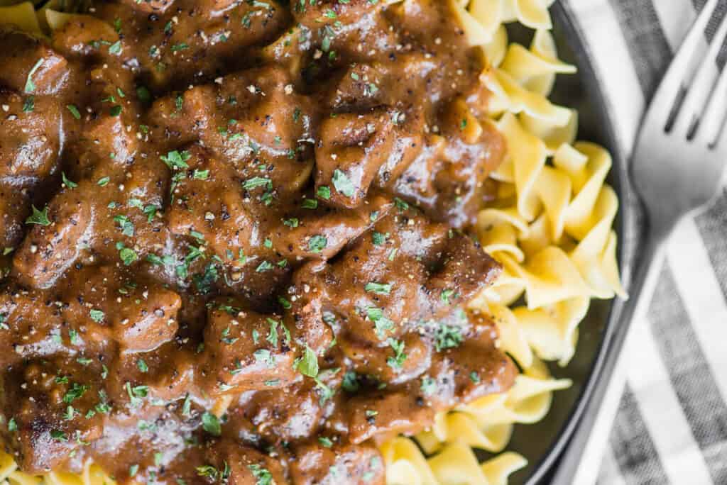 beef tips and gravy over noodles