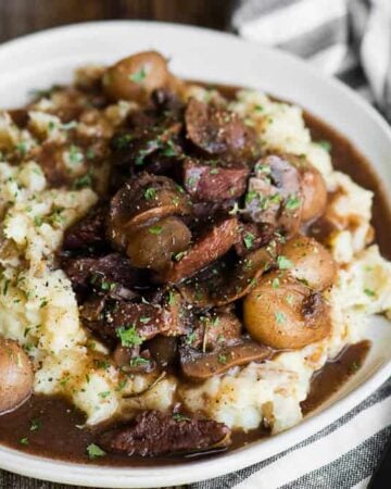 bowl of homemade beef burgundy over mashed potatoes