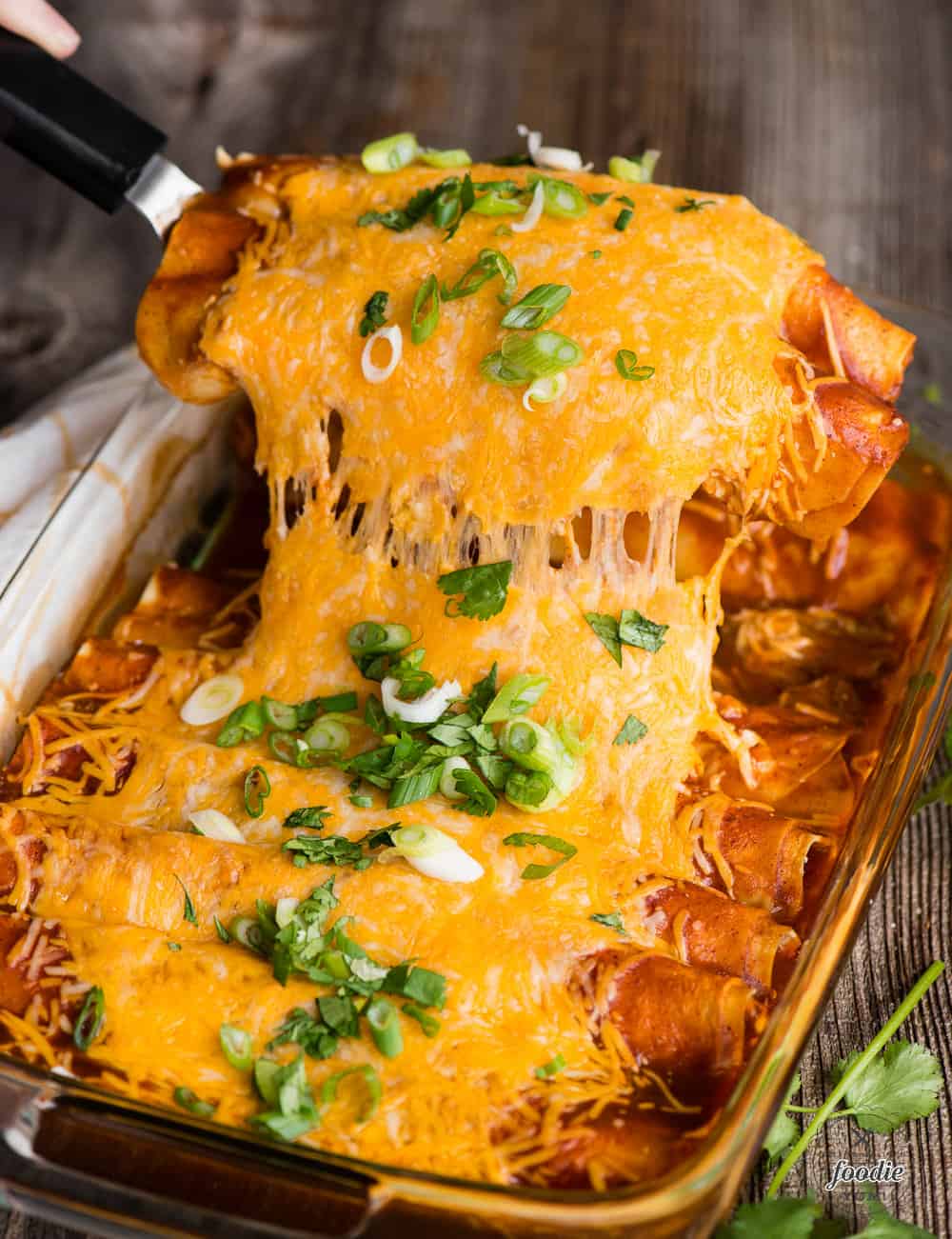 homemade beef enchiladas with red sauce covered in cheese
