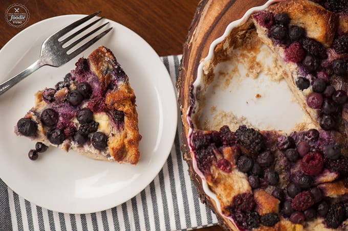 slice of berry bread pudding with fork