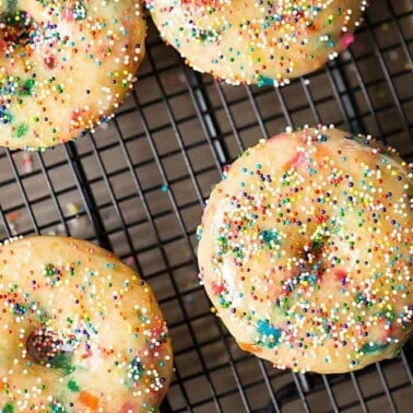 Colorful Birthday Cake Baked Donuts are a real treat for any occasion. This easy to make recipe will put a smile on anyone's face!