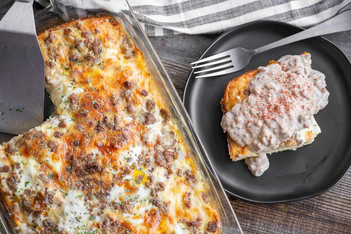 baked breakfast casserole with egg, sausage, cheese, and biscuits smothered in sausage gravy.