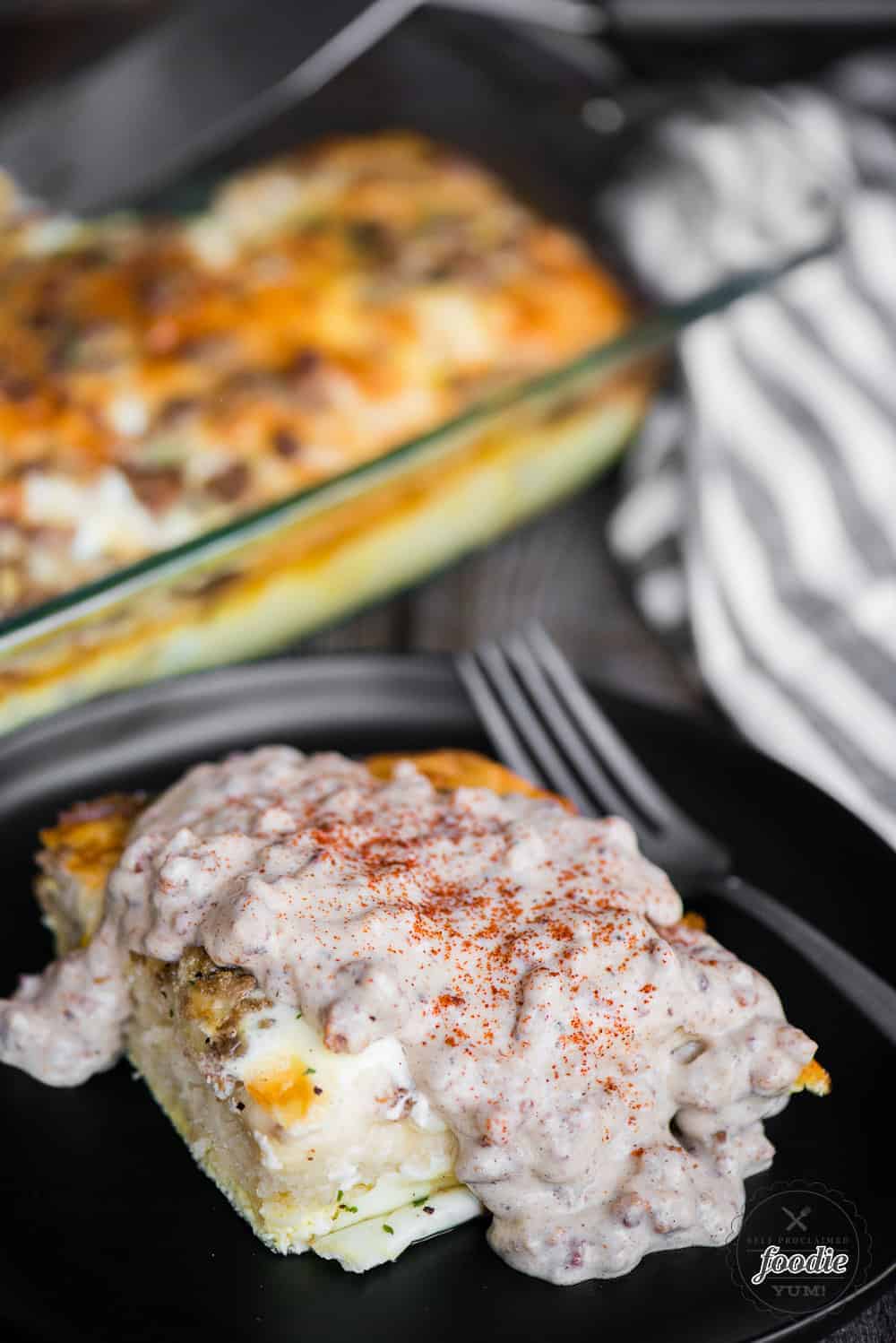 plate with a piece of homemade biscuits and gravy casserole