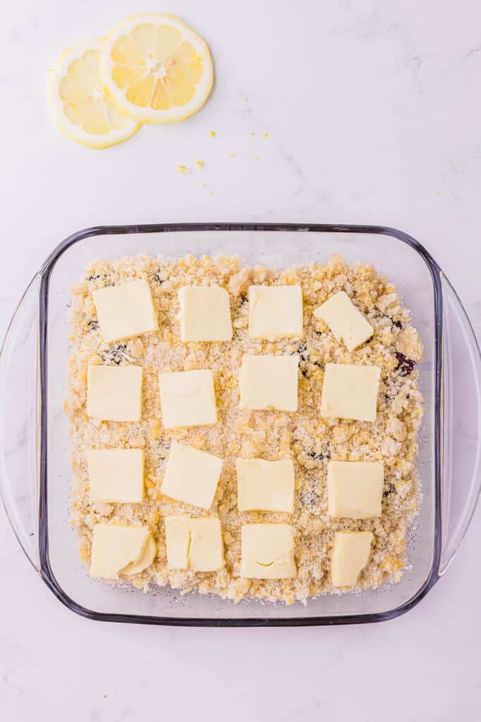 thin slices of butter on top of cobbler mixture.