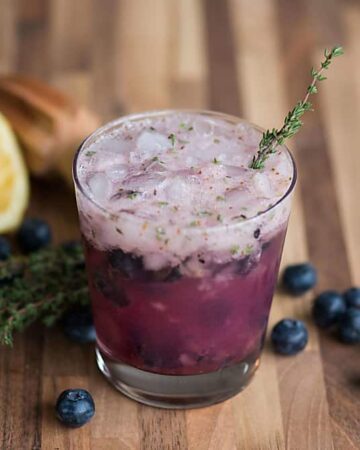 Summer cocktails don't get much easier than this tart, sweet, and refreshing Blueberry Thyme Crush Cocktail made with vodka or gin!