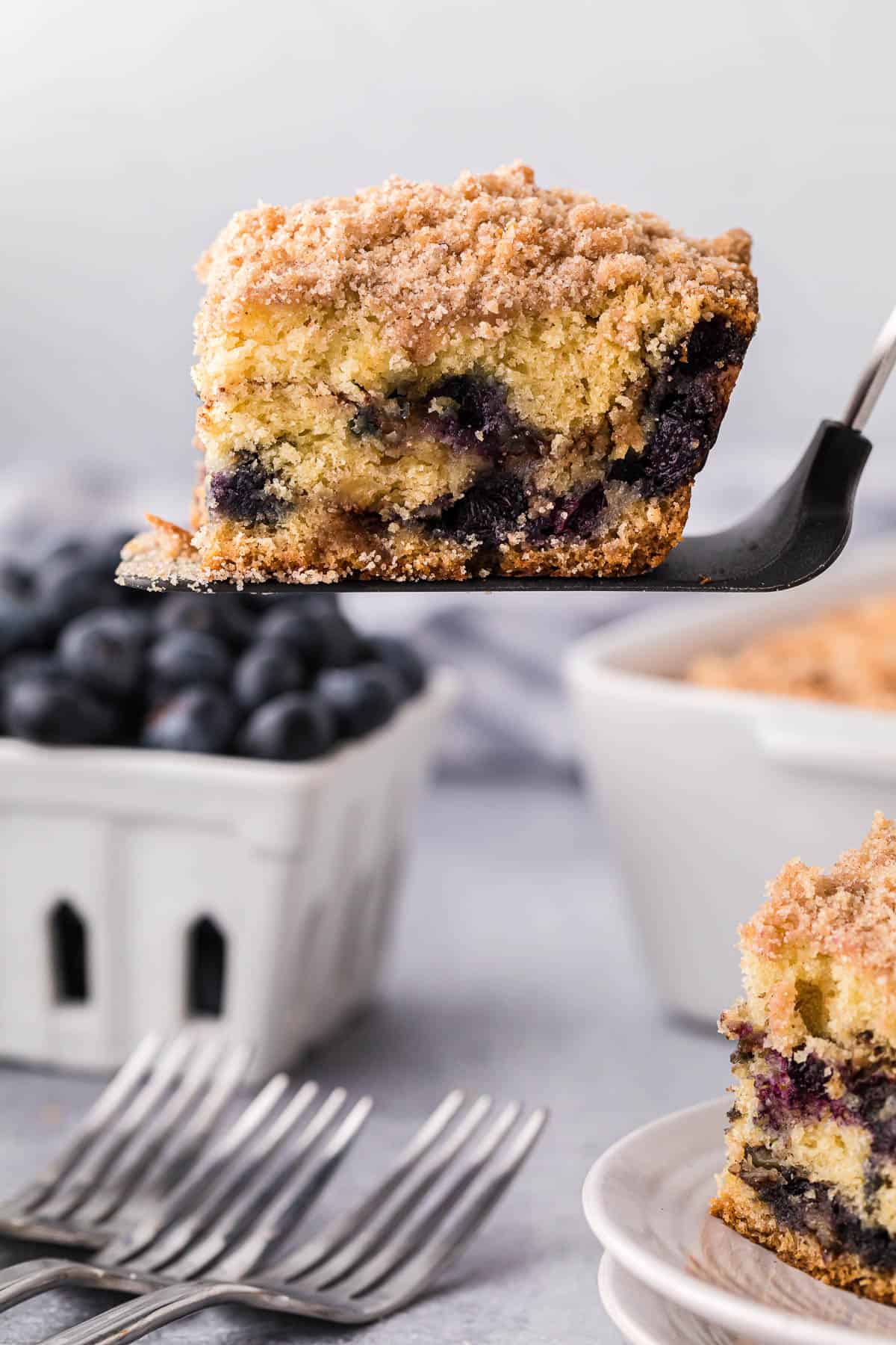 serving of blueberry coffee cake on spatula.