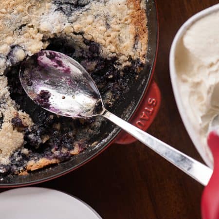 Four simple ingredients and only a few minutes of prep time are all you need to create this mouthwatering BLUEBERRY DUMP CAKE. It's a perfect summer dessert!