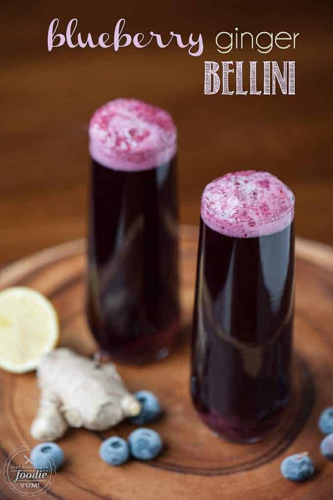 champagne flutes with blueberry cocktail