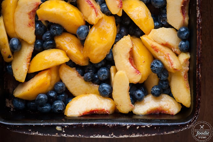 sliced peaches and fresh blueberries