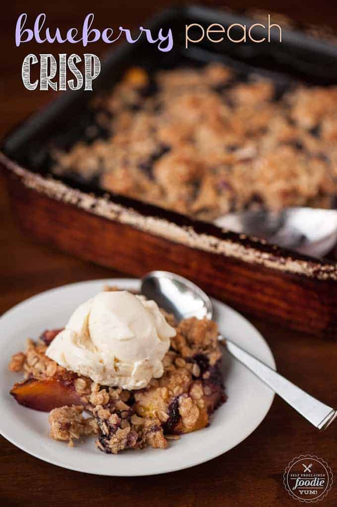 blueberry peach crisp on plate with vanilla ice cream