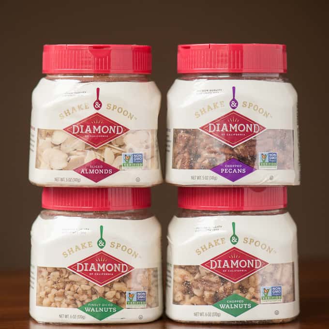 almonds, walnuts, and pecans in jars
