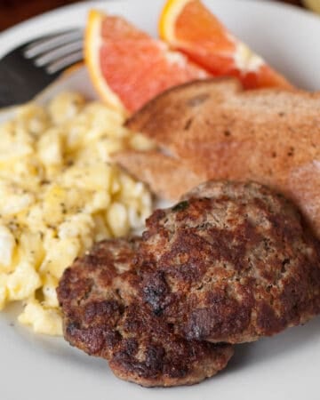homemade breakfast sausage patties with scrambled eggs and toast