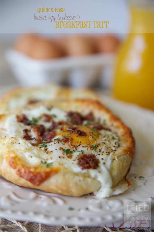 A Quick and Easy Bacon, Egg & Cheese Breakfast Tart on a white plate.
