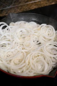 sliced onions in pan
