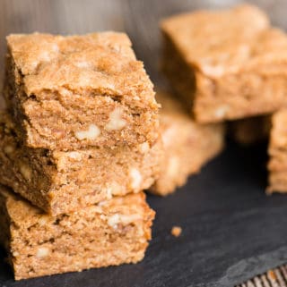 Brown Butter Blondies are a sweet and chewy dessert bar. Think of them as vanilla brownies. This blondie recipe cooks a vanilla bean and walnut pieces in butter until the browned butter becomes nutty and delicious. Brown sugar makes them chewy and perfectly sweet. These brown butter brownies will satisfy any craving!