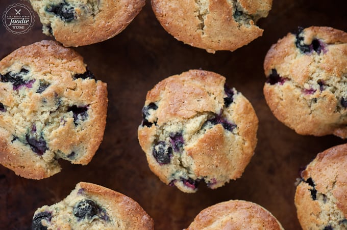 looking down at golden brown homemade blueberry muffins 