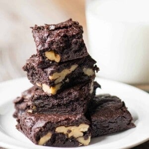 stack of brown butter brownies with walnuts.