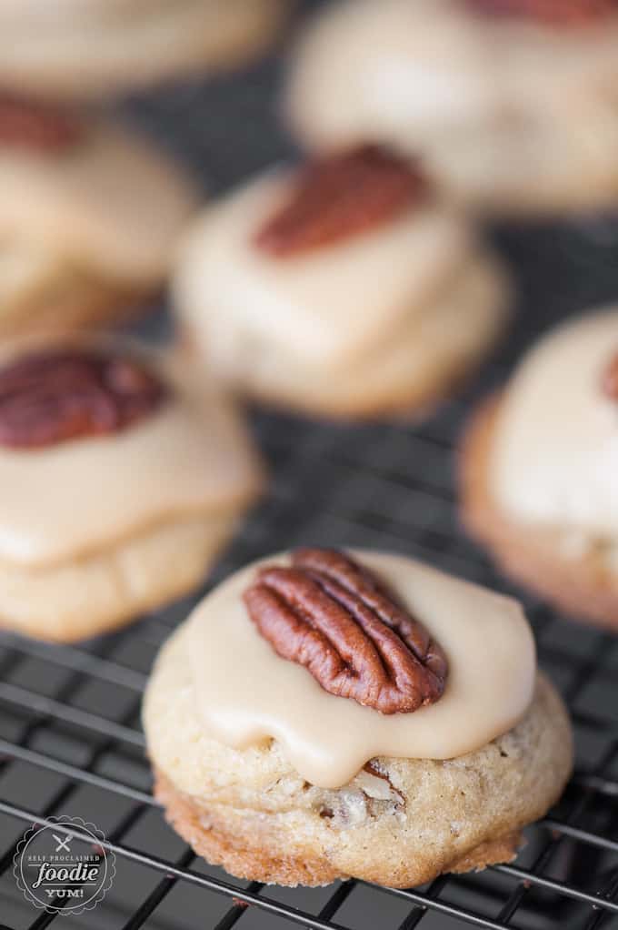 A close up of brown sugar pecan cookie with a pecan on top