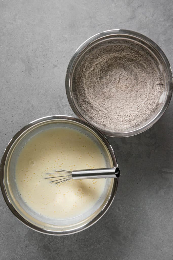 wet and dry ingredients in separate bowls for pancake recipe