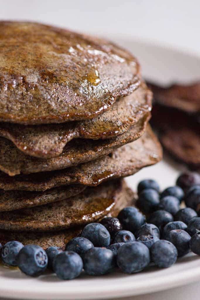 close up of a stack of Buckwheat Pancakes with blueberries