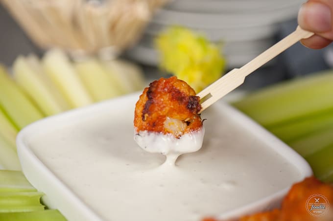 Buffalo Cauliflower Bites taste so much like traditional chicken wings, but are a healthy vegetarian version perfect for a light snack.