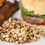 sauteed corn next to a burger