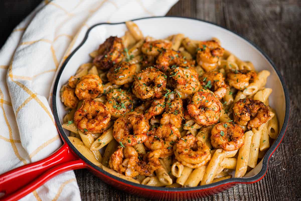 cajun shrimp pasta with cream sauce in large skillet