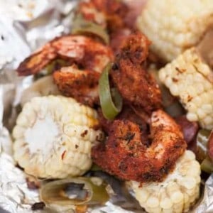 A plate of food with shrimp and vegetables
