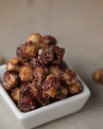 These roasted Candied Hazelnuts are perfectly sweet with a spicy kick. They are an excellent addition to salads or desserts.