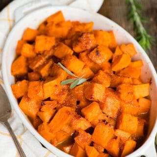 white oval dish with candied sweet potatoes
