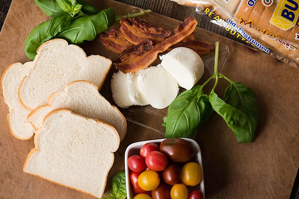 ingredients for caprese grilled cheese on a brown dish