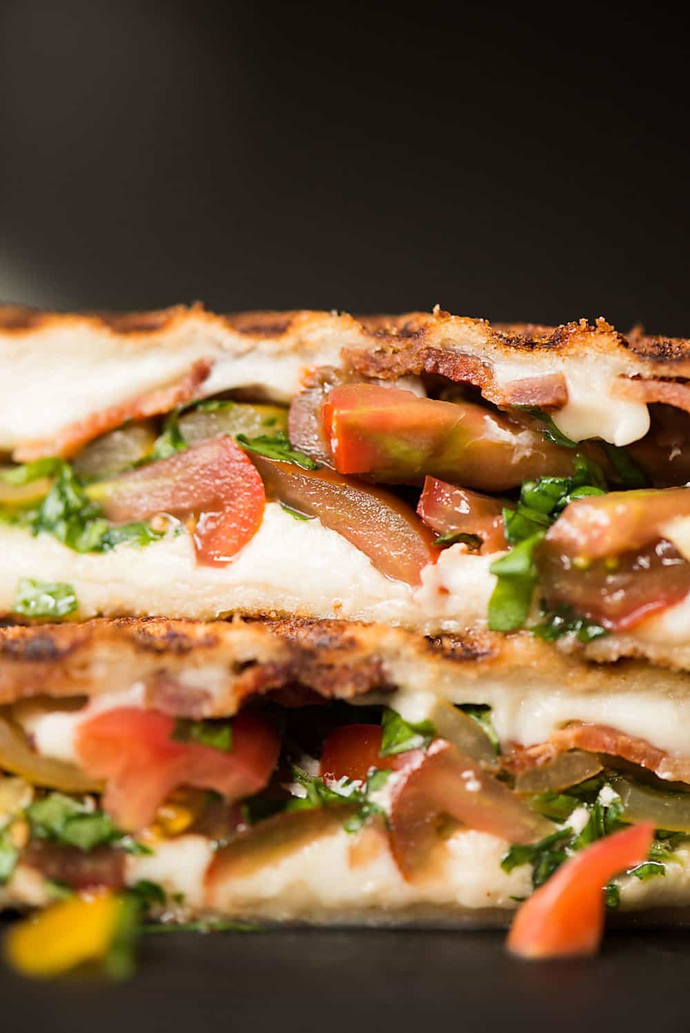 a close up of caprese grilled cheese