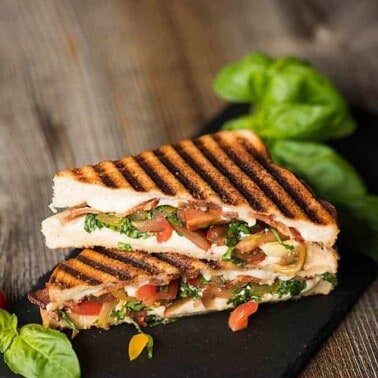 I can't think of a better lunch than this Caprese Grilled Cheese made with crisp bacon, soft mozzarella, tomatoes, basil, and super soft bread!
