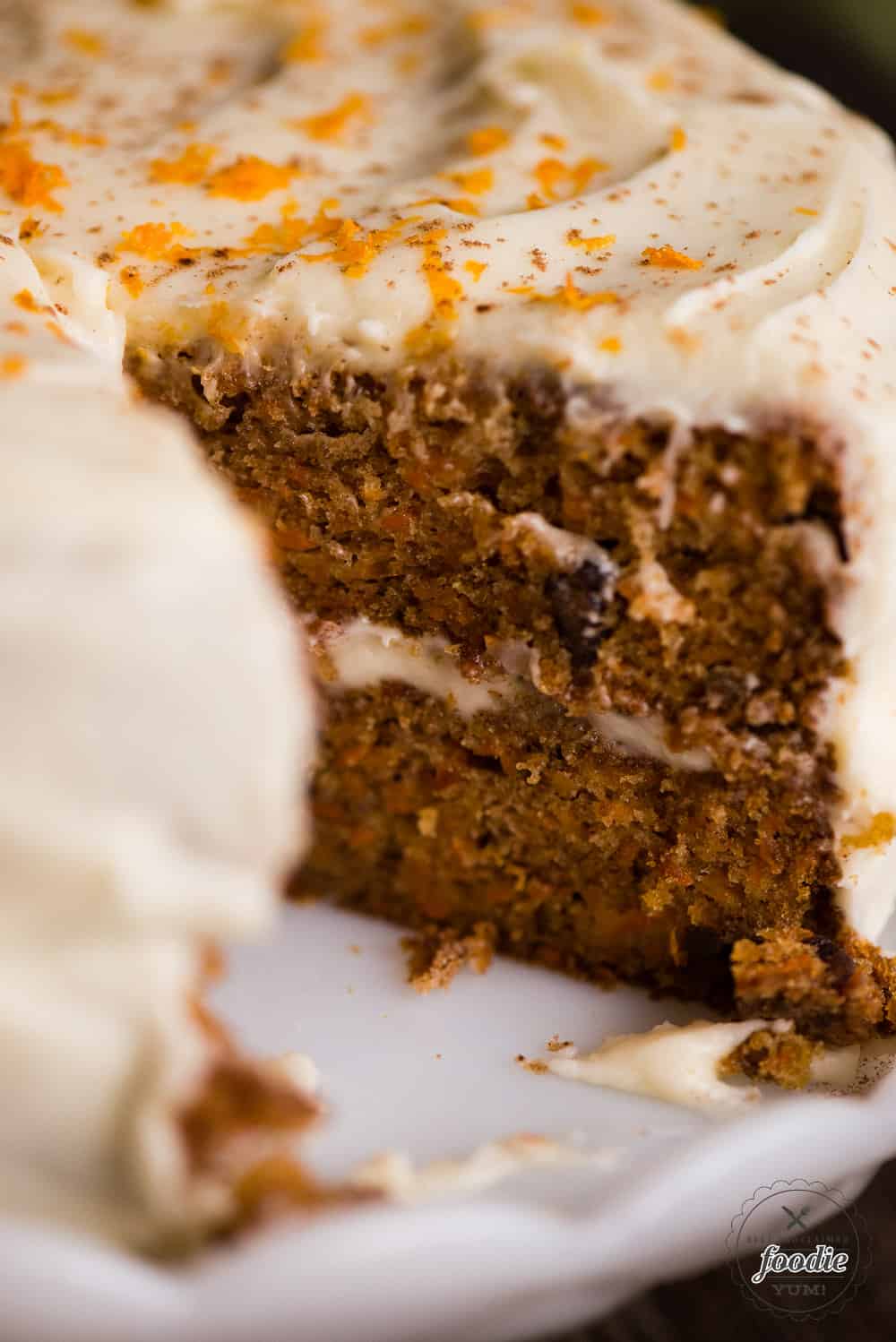 moist carrot cake with slice taken out