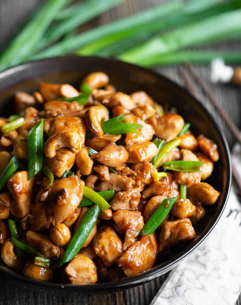 homemade Cashew Chicken in dark bowl