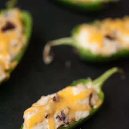 These spicy and zesty Cheesy Bacon Ranch Jalapeno Poppers make the perfect two bite appetizer for any game day celebration.