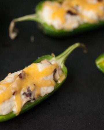 These spicy and zesty Cheesy Bacon Ranch Jalapeno Poppers make the perfect two bite appetizer for any game day celebration.
