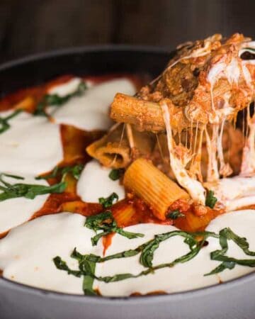 Cheesy Baked Rigatoni Pasta with ricotta, mozzarella, and Italian sausage is the kind of dinner your family will crave. You can even prepare this dinner casserole ahead of time and then heat it in the oven when you're ready to eat. Pair it with a nice green salad and you will have a hearty meal.
