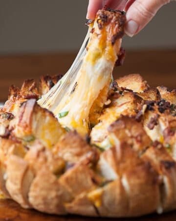 Words cannot explain how delicious this Cheesy Chipotle Pull Apart Bread is. It is the perfect tasty appetizer for any game day feast.