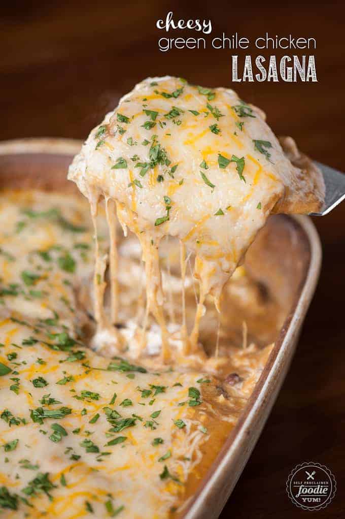 scooping out a serving of lasagna with chicken and green chile