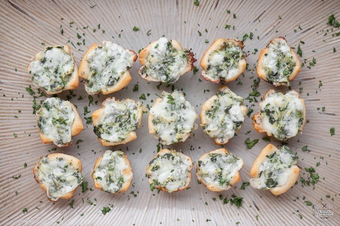 spinach artichoke bites on a white dish