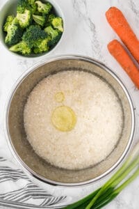 rice and oil in instant pot.
