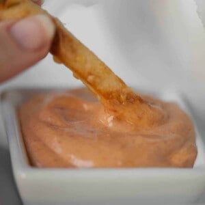 fry dipping in aioli sauce