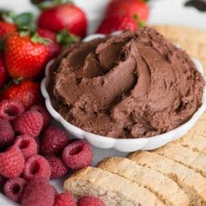 bowl chocolate cream cheese fruit dip with fruit and cookies
